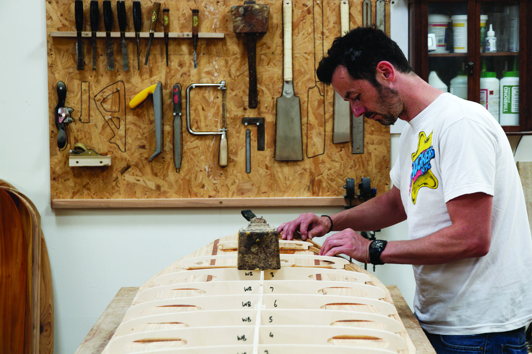 Tracy Martin and Paul Otter wooden surfboard workshop June 2014 martin checking rail strips