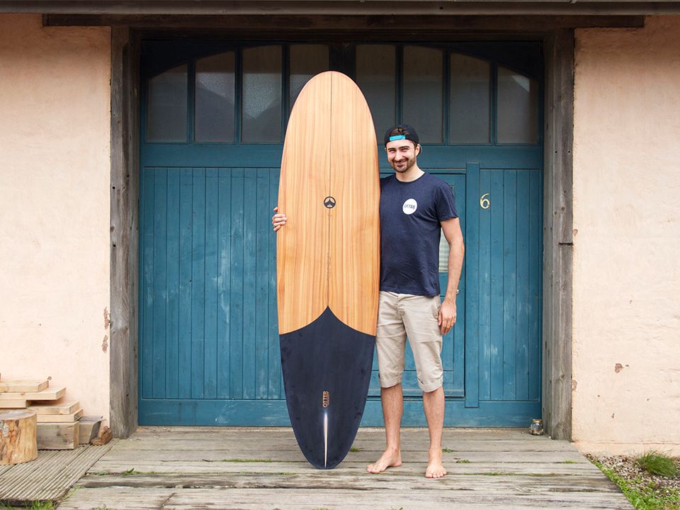 Otter wooden surfboard workshop blue doors