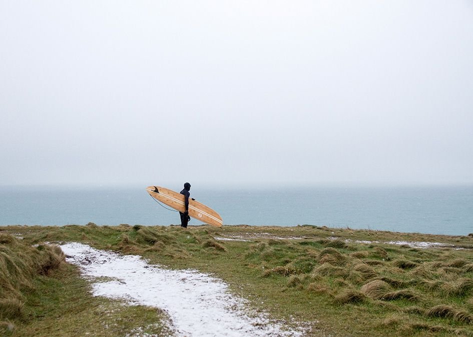 Otter wooden surfboard snow