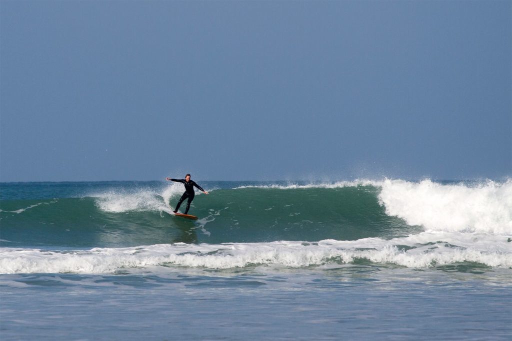 Otter wooden surfboard surfer wave