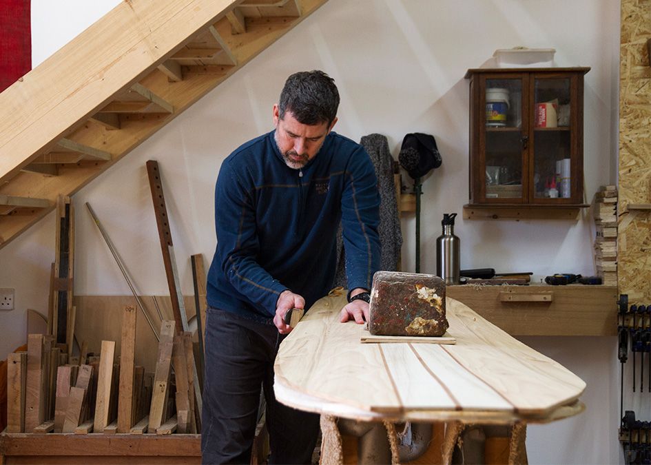 Otter wooden surfboard workshop planing