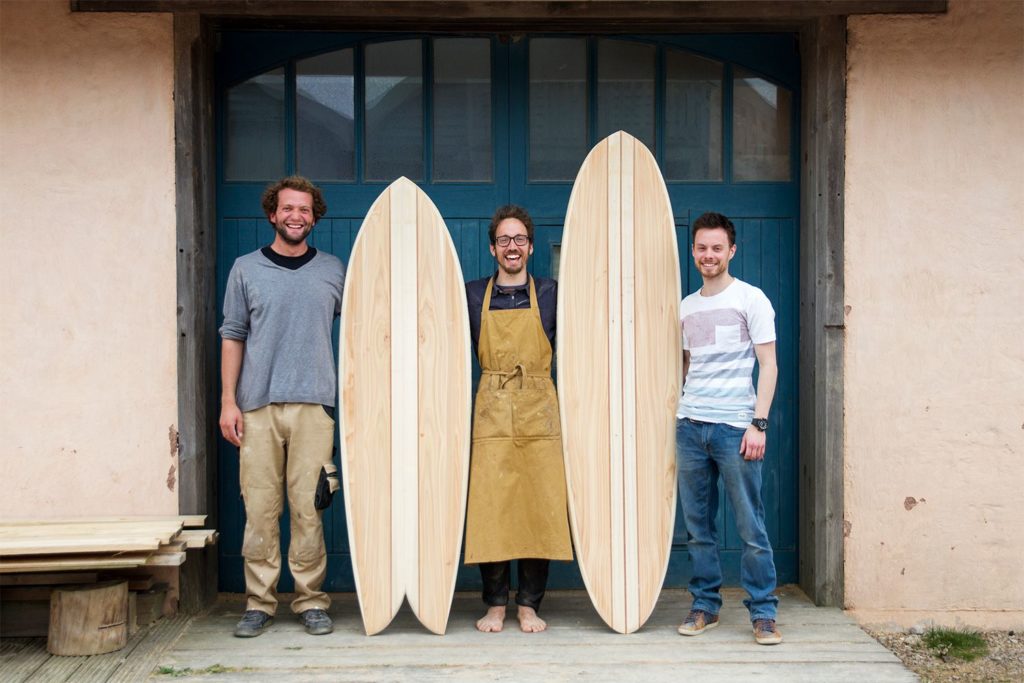 Otter wooden surfboard workshop blue doors