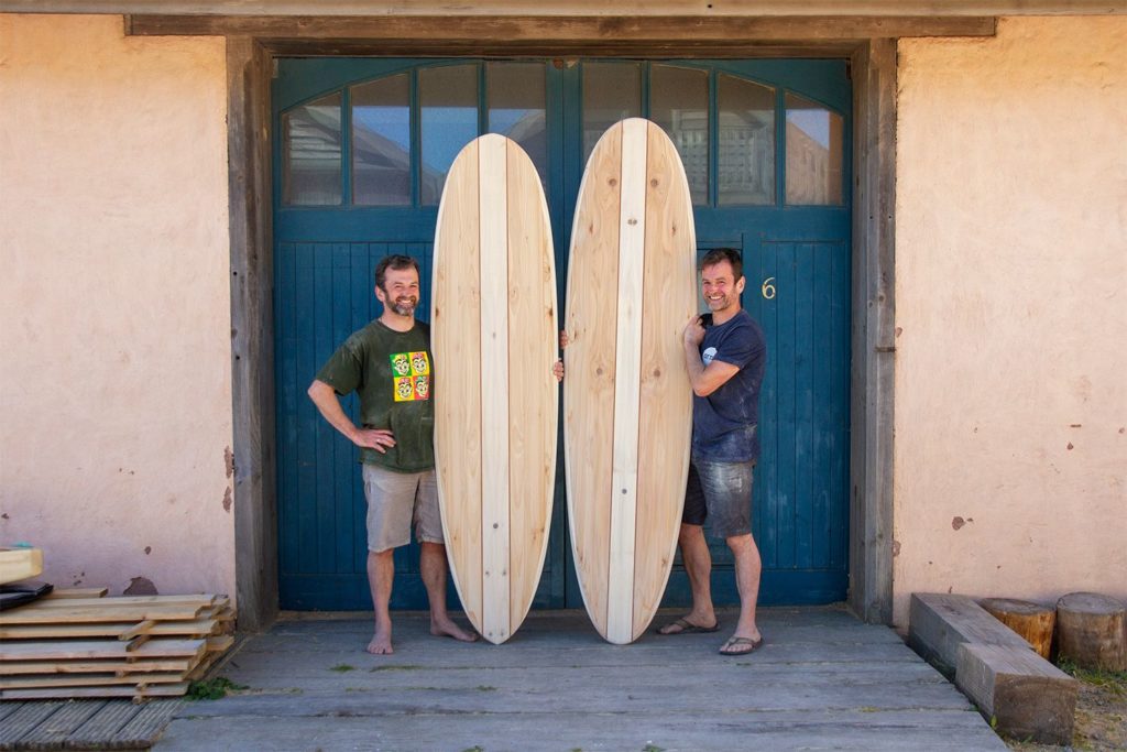 Otter wooden surfboard workshop blue doors