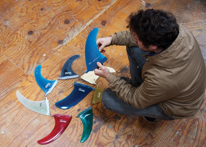 mixture of single fins on the otter workshop floor