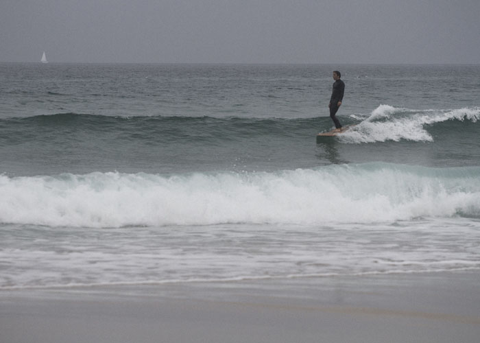James Otter Surfing his wooden surfboard in cornwall