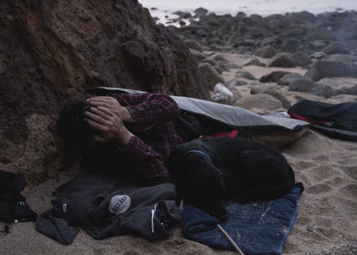 James Otter waking up on the beach