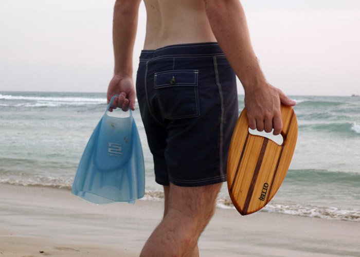 otter surfboards wooden bodysrufing handplane on beach in sri lanka