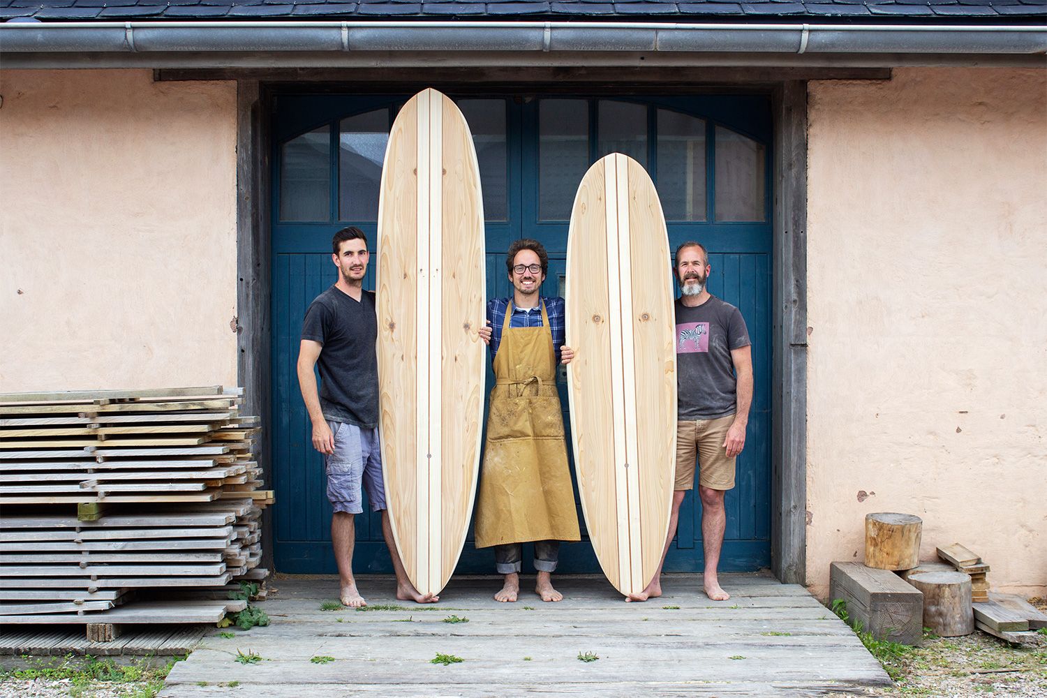 Otter wooden surdboard workshop blue doors