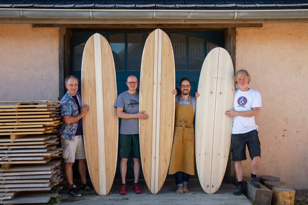 Otter wooden surfboard workshop blue doors