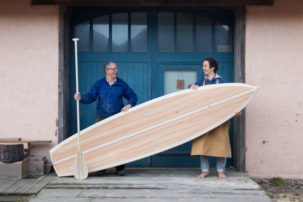 Otter SUP blue doors wooden workshop paddle