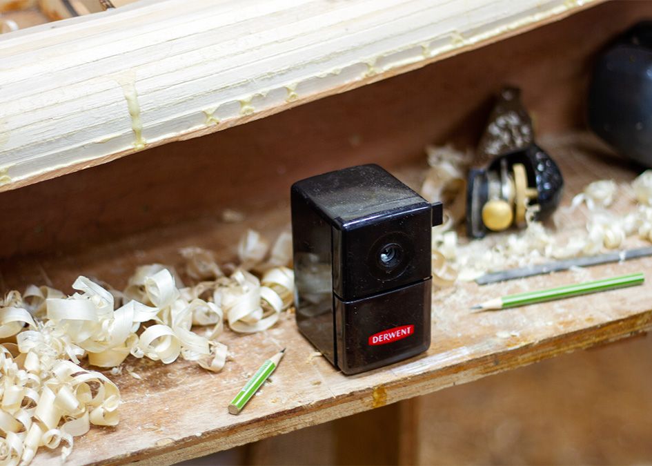 Pencil sharpener tool wood shavings shaping wooden surfboard Otter
