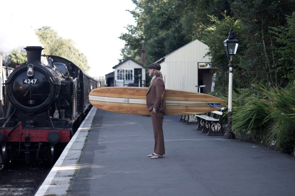 Gideon Wicket otter wooden surfboard train station