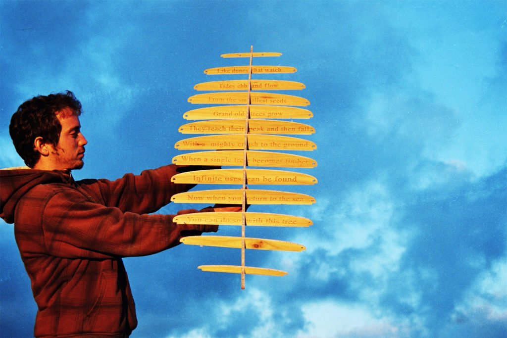 The Storyboard by James Otter and Mat Arney Wooden Surfboard Project James holding frame aloft