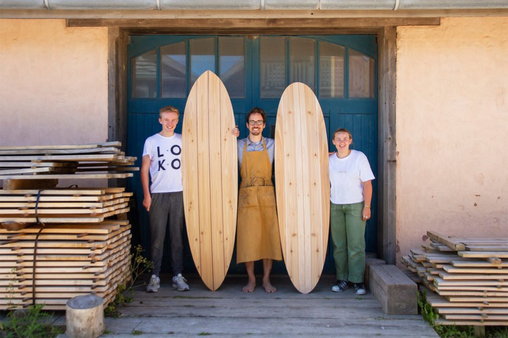 Otter Surfboards Wooden Surfboard Workshop Course Porthtowan Cornwall Rory and Gigi blue doors portrait