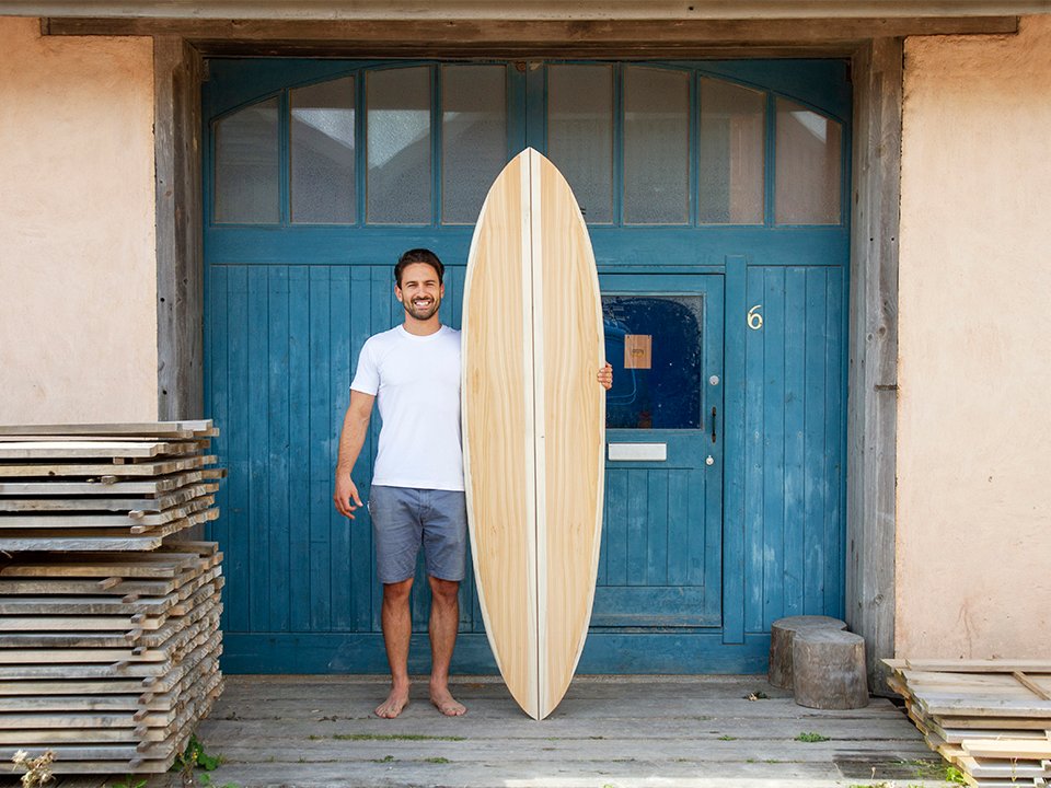 Otter Surfboards wooden surfboard making course with Ben and Marlow Marlows finished board blue doors