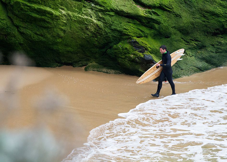 surfer wooden surfboard otter beach