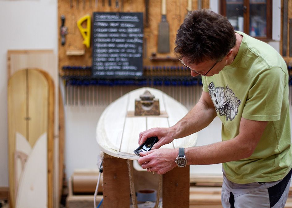 otter wooden surfboard workshop shaping