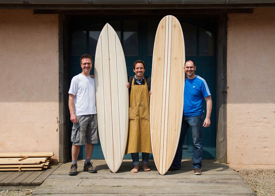 otter wooden surfboard workshop blue doors