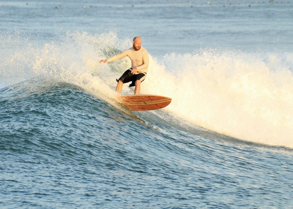 Otter wooden surfboard wave surfer