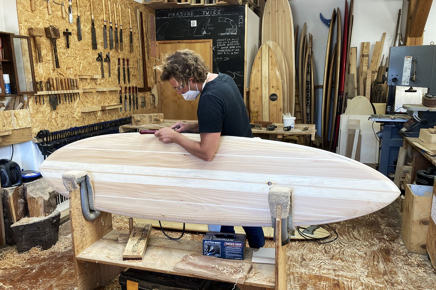 Sam Shaping rails on edge wooden surfboard