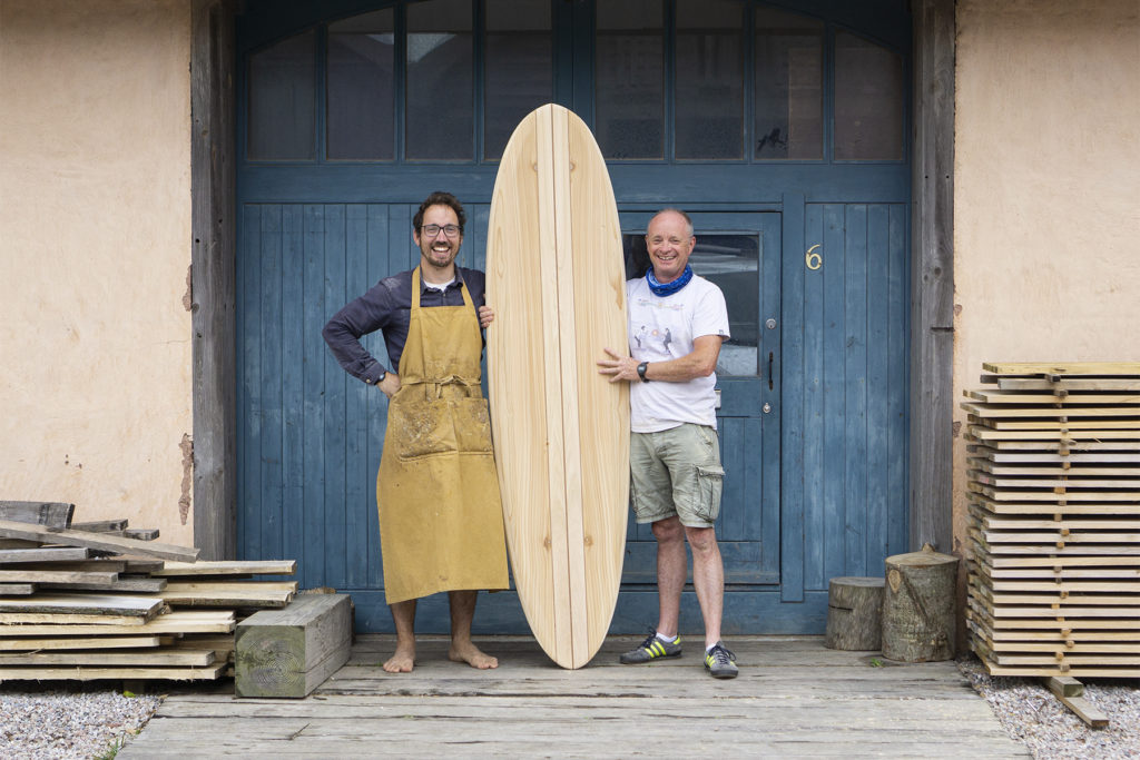 Tim wooden surfboard workshop otter blue doors
