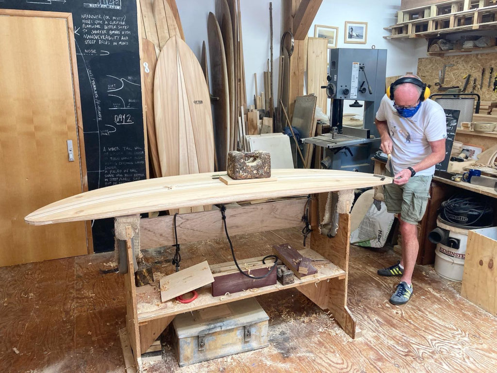 otter wooden surfboard workshop shaping nose