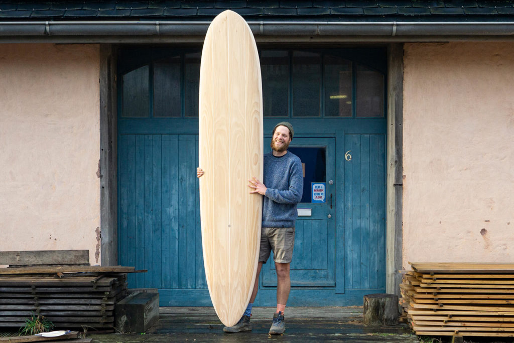 Otter surfboard wooden surfboard workshop blue doors