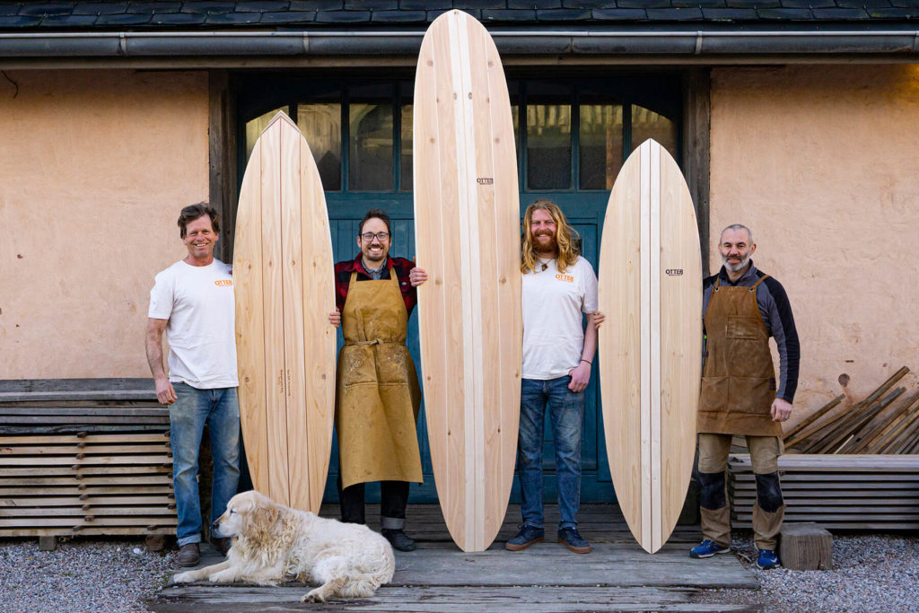 otter wooden surfboards workshop blue doors