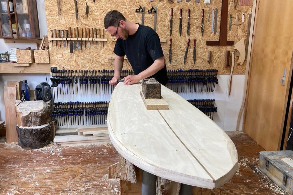 Otter wooden surfboard shaping