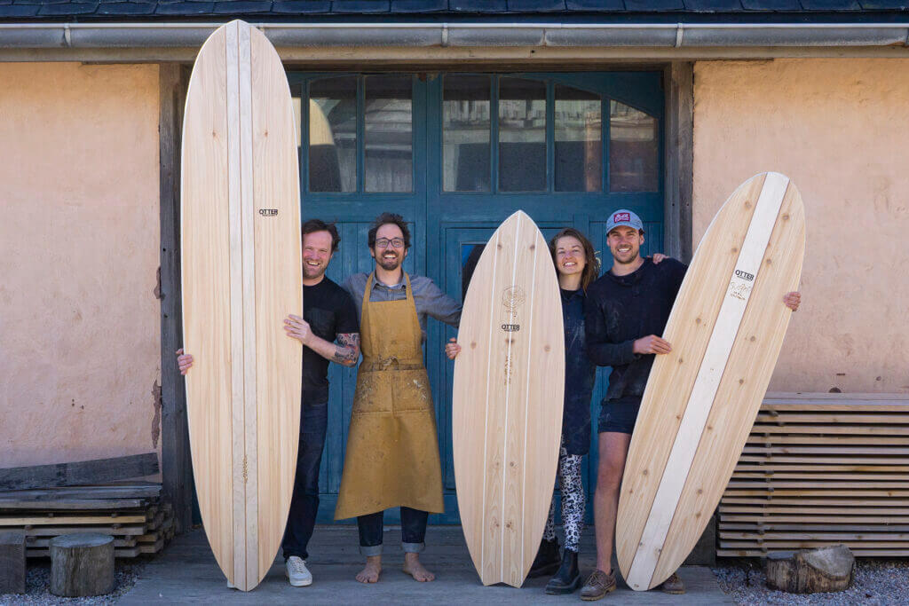 otter wooden surfboard workshop blue doors