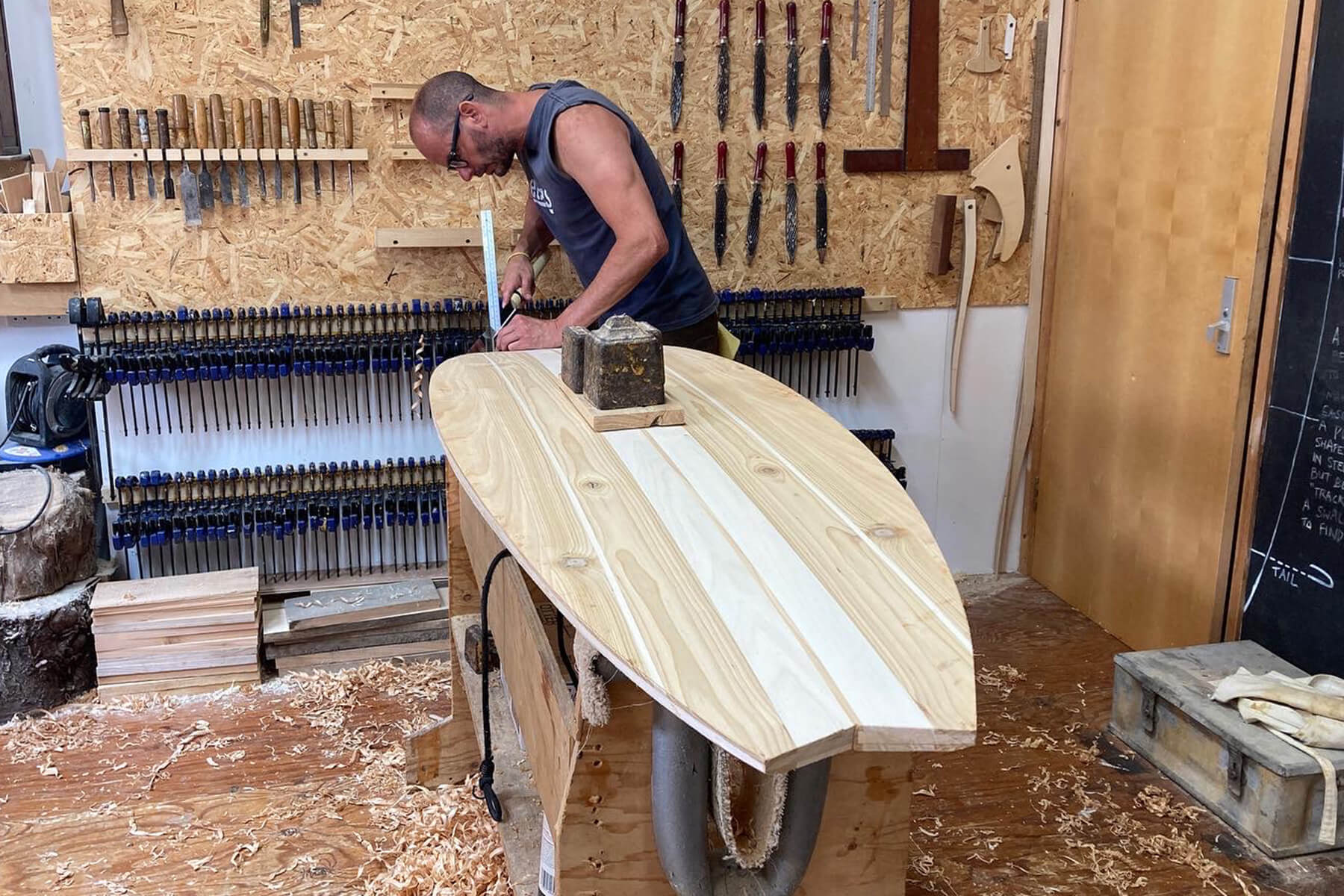 Otter wooden surfboard workshop shaping
