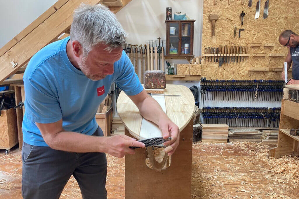 Otter wooden surfboard workshop shaping