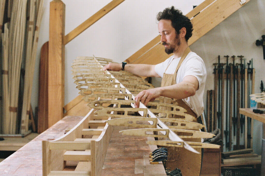 otter wooden surfboard workshop frame