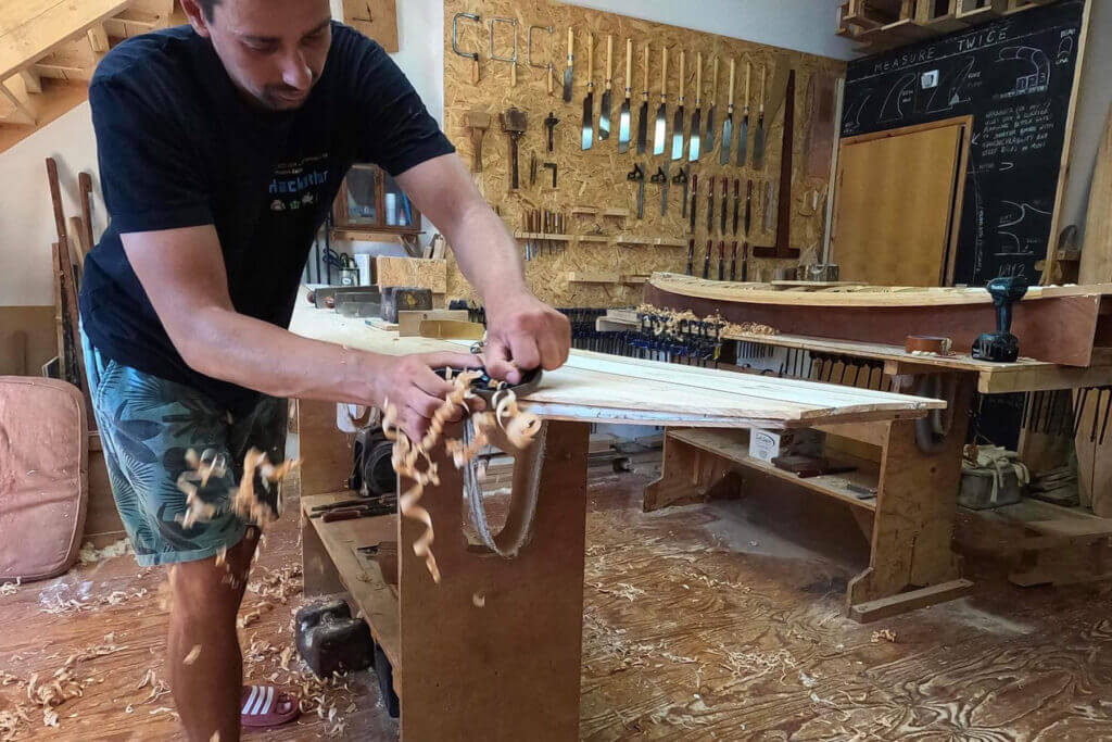 otter wooden surfboard workshop shaping