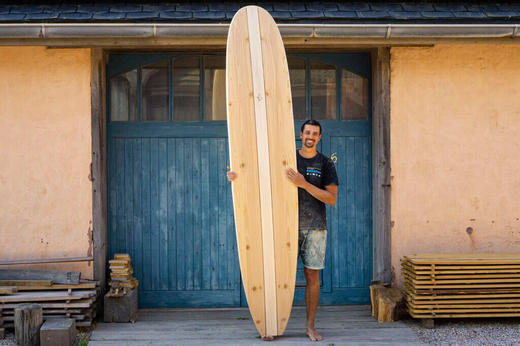 otter wooden surfboard workshop blue doors