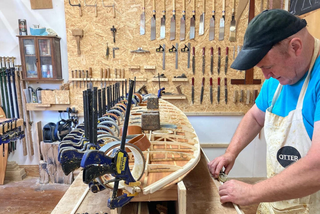 otter wooden surfboard workshop shaping