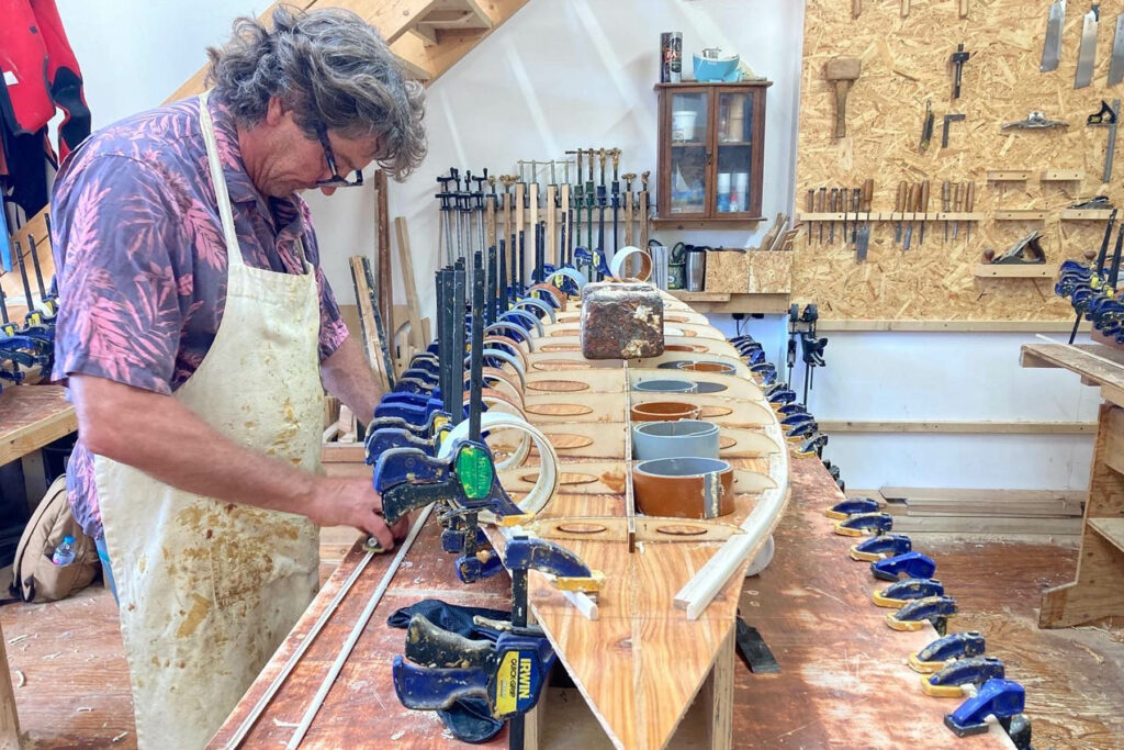 otter wooden surfboard workshop shaping
