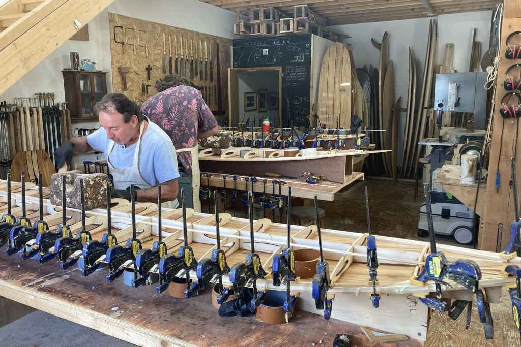 otter wooden surfboard workshop shaping