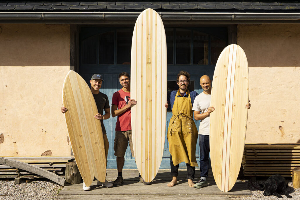 otter wooden surfboards workshop blue doors