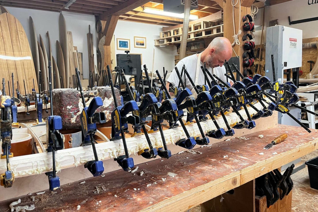 otter wooden surfboard workshop shaping