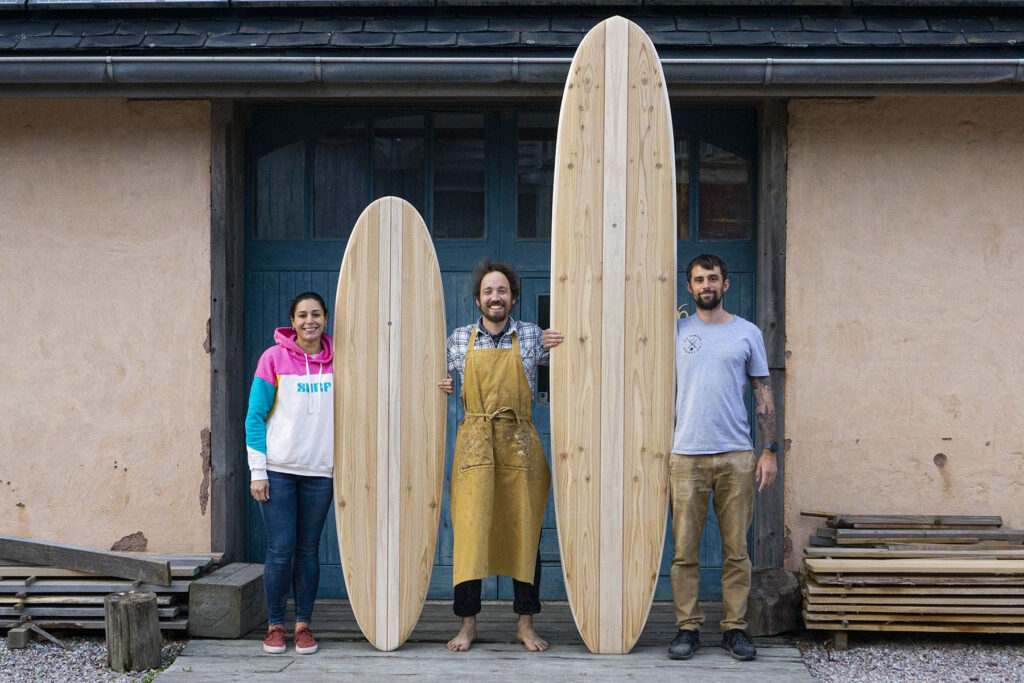 otter wooden surfboards workshop blue doors