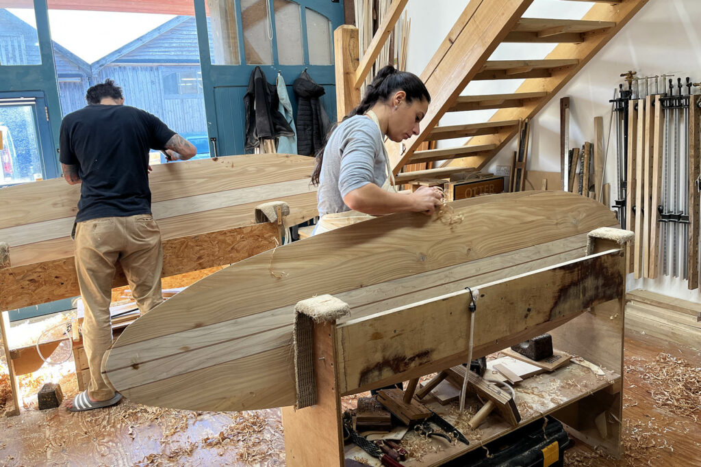 otter wooden surfboard workshop shaping