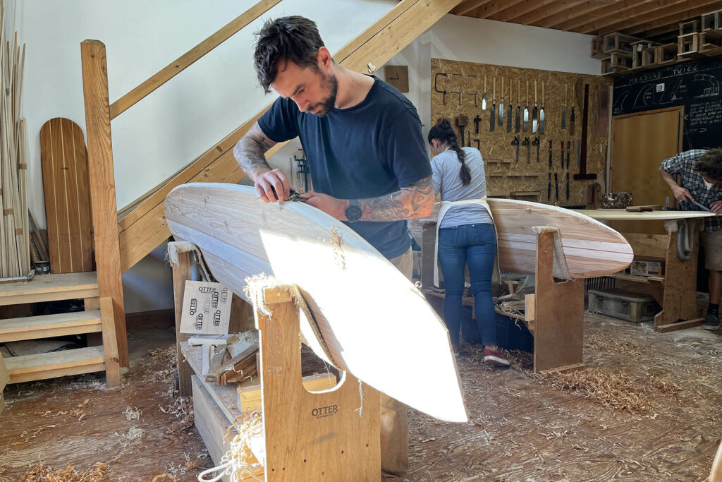 otter wooden surfboard workshop shaping