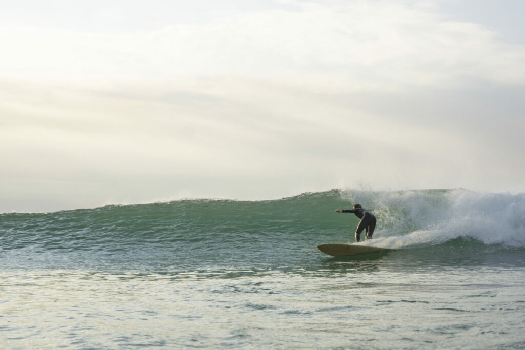 otter wooden surfboards surfing wave