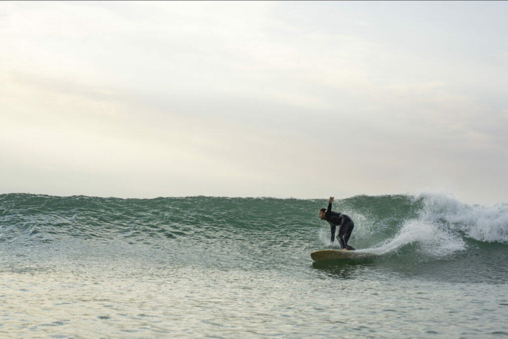 otter wooden surfboards surfing wave