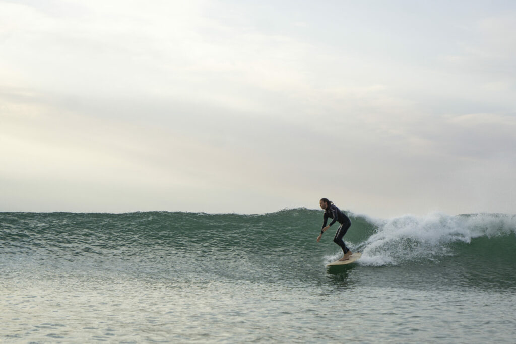 otter wooden surfboards surfing wave