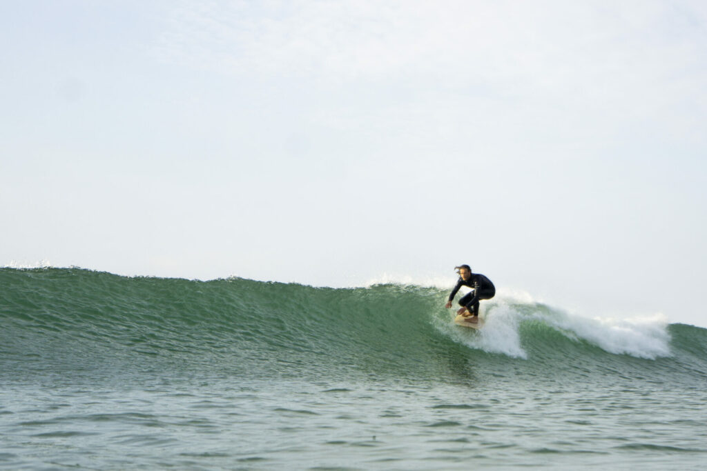 otter wooden surfboards surfing wave