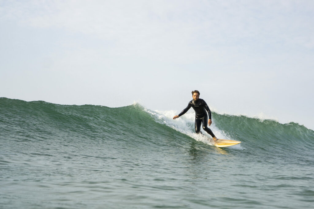 otter wooden surfboards surfing wave