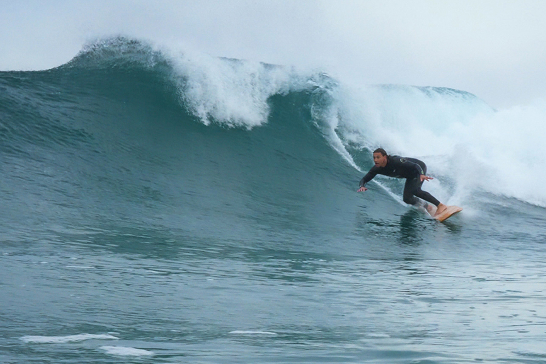 alan stokes otter wooden surfboards surfer wave bottom turn