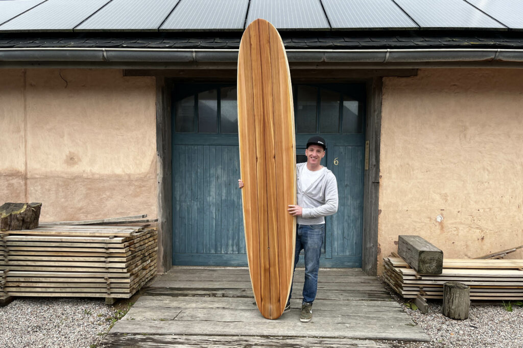 otter wooden surfboards workshop blue doors